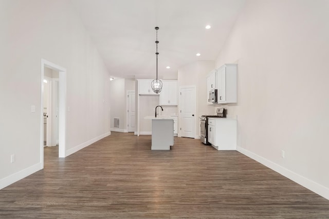 unfurnished living room featuring dark hardwood / wood-style floors and sink