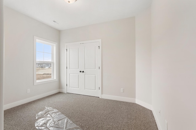 view of carpeted spare room