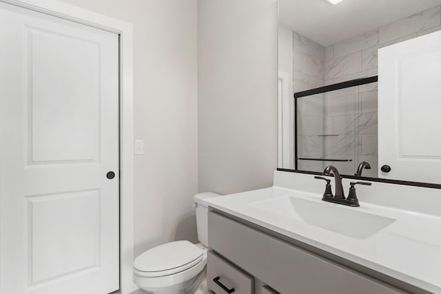 bathroom with toilet and oversized vanity