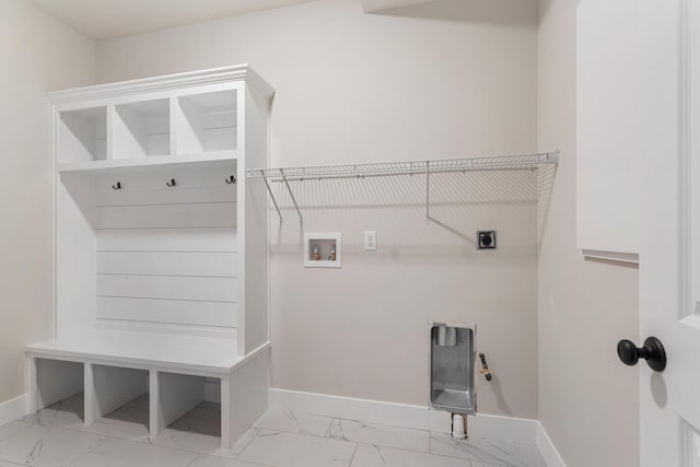 laundry room with hookup for an electric dryer, light tile flooring, and washer hookup