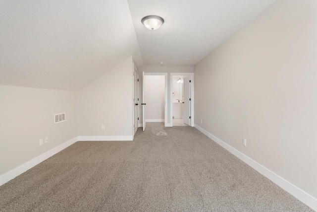 bonus room featuring carpet