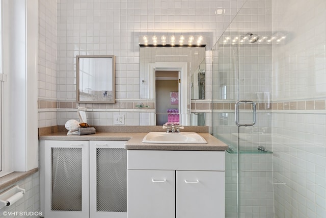 bathroom with tile walls, tasteful backsplash, and vanity