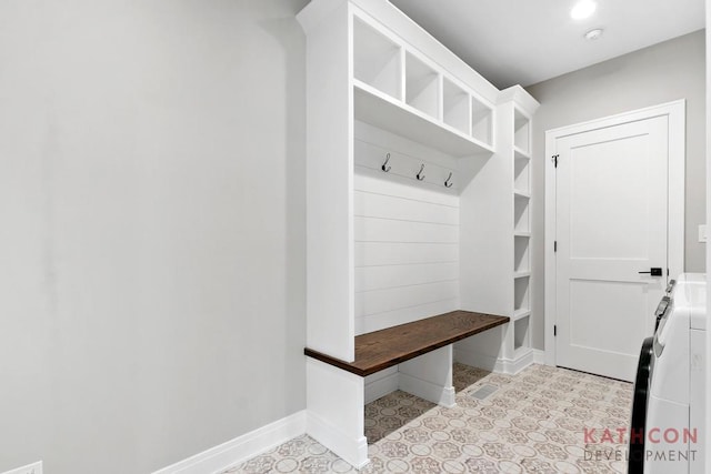 mudroom featuring light tile floors