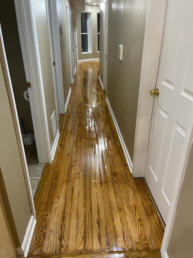 hall featuring wood-type flooring