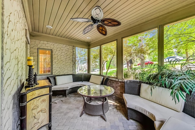 sunroom / solarium with a wealth of natural light, ceiling fan, and wood ceiling