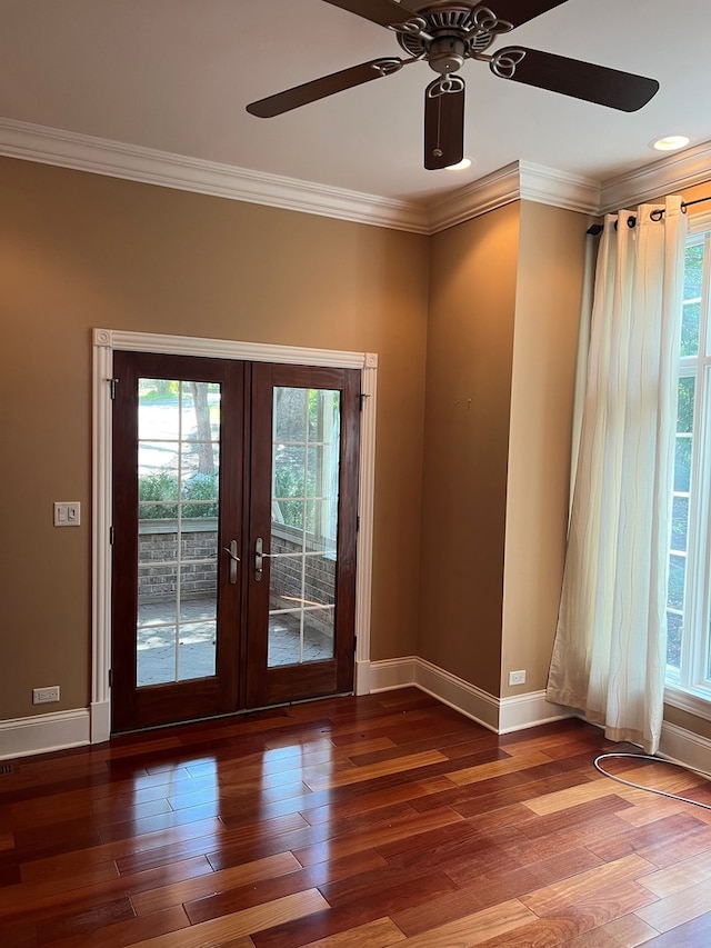 unfurnished room featuring ceiling fan, french doors, hardwood / wood-style flooring, and ornamental molding