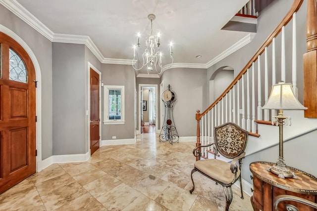 entryway with a notable chandelier, crown molding, and light tile floors