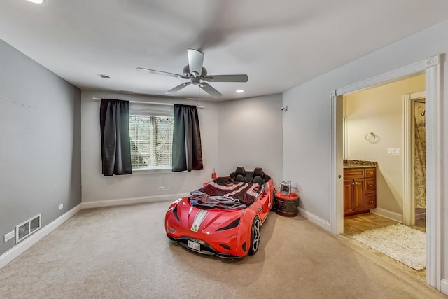 living area featuring ceiling fan and light colored carpet