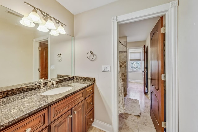 bathroom with tile floors and large vanity