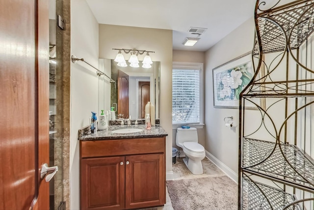 bathroom with tile flooring, oversized vanity, and toilet