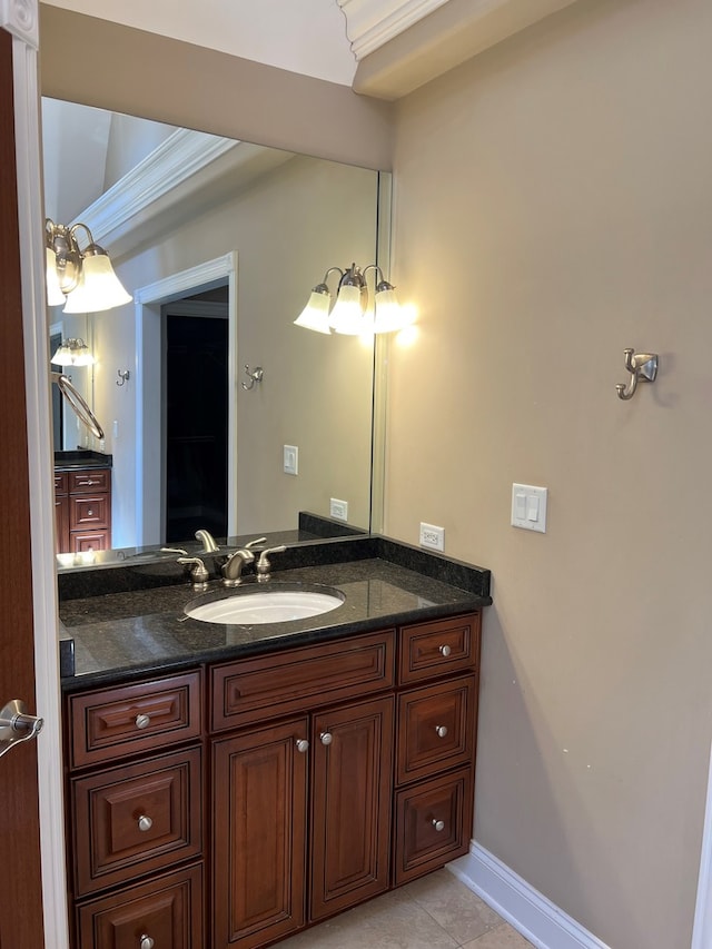 bathroom with tile flooring, crown molding, and vanity