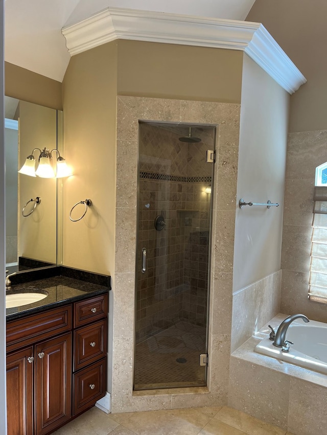 bathroom featuring ornamental molding, vanity, and independent shower and bath