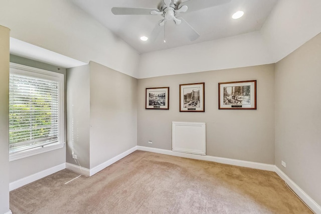 unfurnished room with ceiling fan and carpet flooring