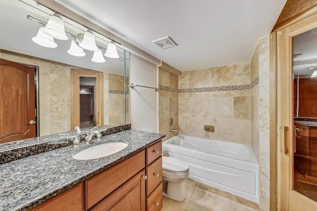 full bathroom featuring tile walls, toilet, tile flooring, tiled shower / bath, and vanity