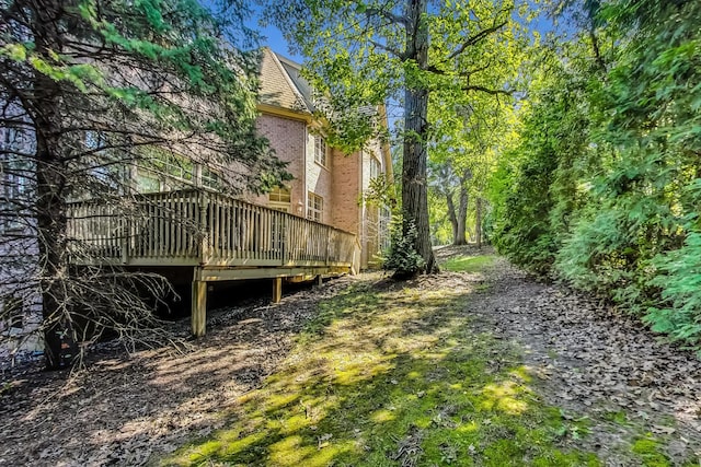 view of yard with a wooden deck