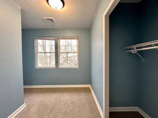 interior space with a textured ceiling