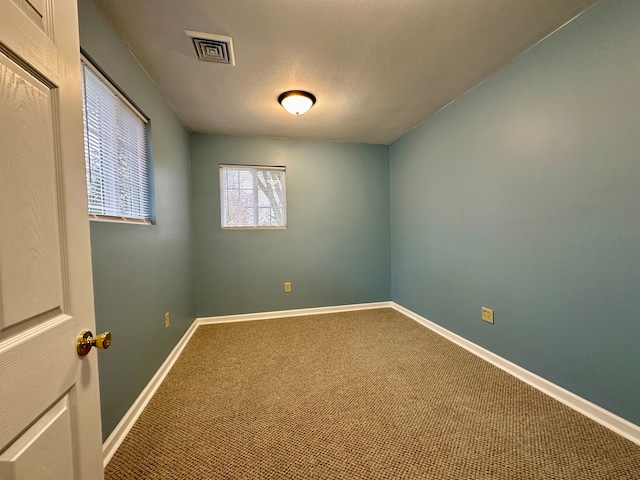 unfurnished room with carpet floors