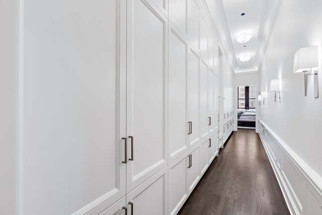 159 E Walton Pl Unit Ph, Chicago, IL 60611 - hallway with dark wood-style flooring, a decorative wall, and crown molding