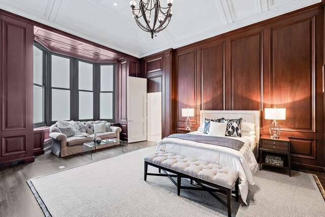 159 E Walton Pl Unit Ph, Chicago, IL 60611 - bedroom featuring a decorative wall, a chandelier, and wood finished floors
