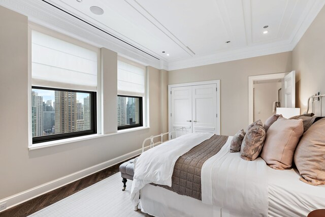 159 E Walton Pl Unit Ph, Chicago, IL 60611 - bedroom featuring recessed lighting, ornamental molding, a closet, wood finished floors, and baseboards