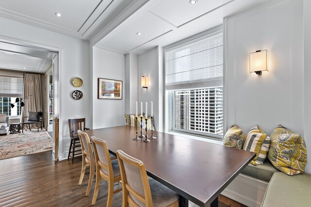 dining area with wood finished floors and recessed lighting