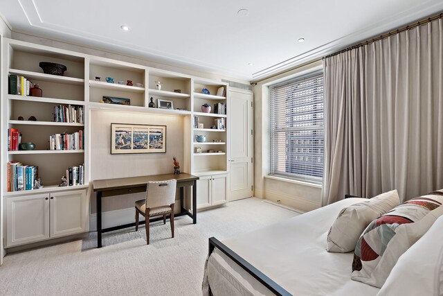 bedroom with light colored carpet