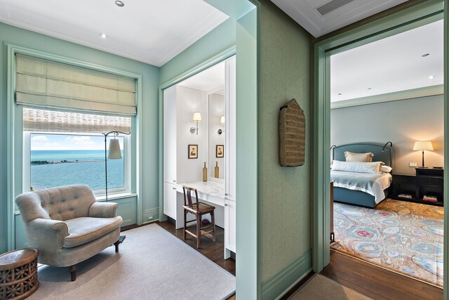 interior space featuring crown molding, visible vents, and dark wood finished floors