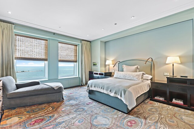 bedroom with recessed lighting and crown molding