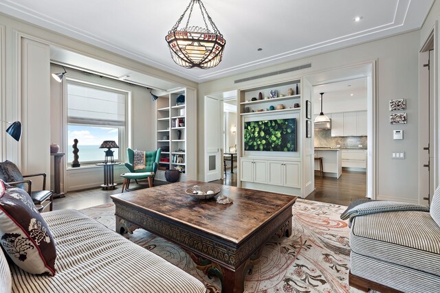 living room with visible vents and wood finished floors