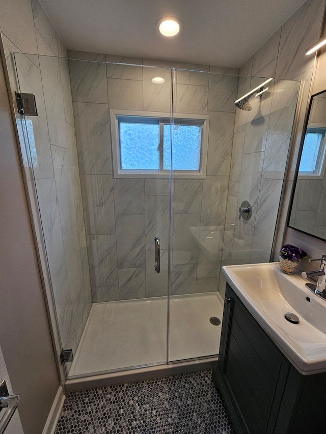 bathroom with vanity, tile patterned floors, and walk in shower