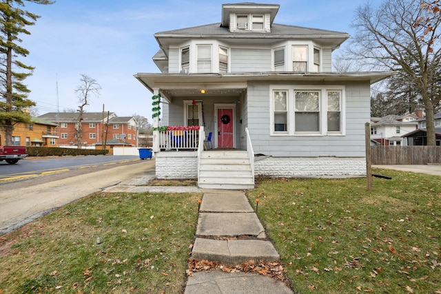 view of front of house featuring a front lawn and a porch