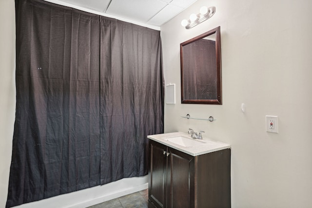 bathroom with tile patterned flooring and vanity