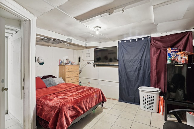 bedroom with light tile patterned floors