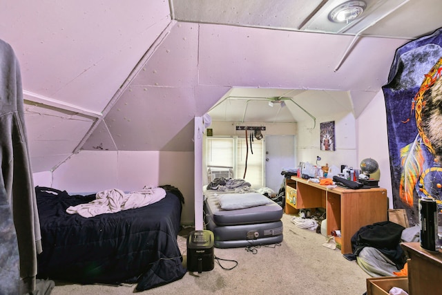 bedroom featuring carpet flooring and lofted ceiling