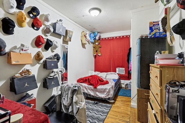 bedroom featuring hardwood / wood-style floors