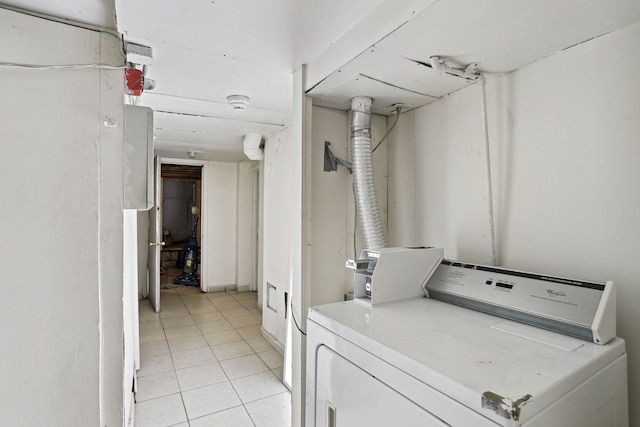 washroom with light tile patterned flooring and washer / dryer