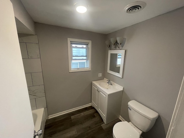 full bathroom with shower / bathing tub combination, vanity, toilet, and wood-type flooring