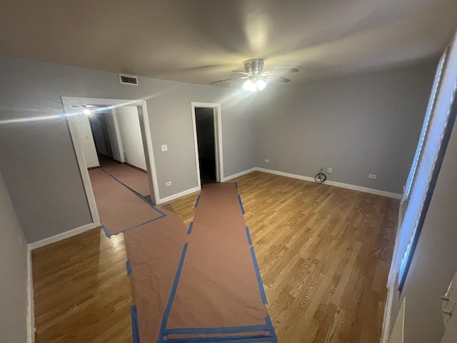 interior space featuring hardwood / wood-style floors and ceiling fan