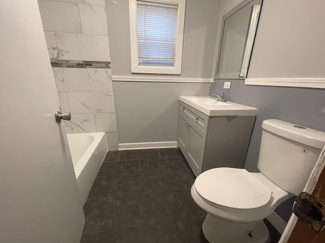 full bathroom featuring toilet, vanity, tile patterned floors, and tiled shower / bath combo