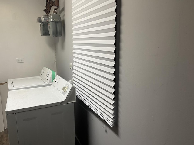 clothes washing area featuring washer and dryer