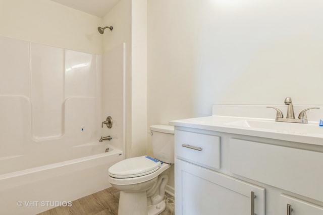 full bathroom with vanity, toilet, bathing tub / shower combination, and hardwood / wood-style floors