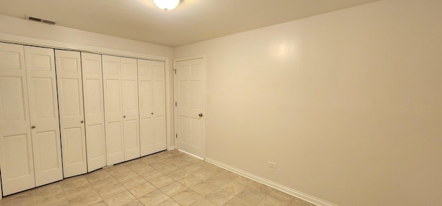 unfurnished bedroom with a closet