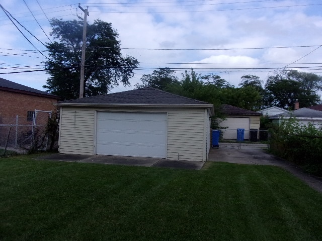 garage with a yard