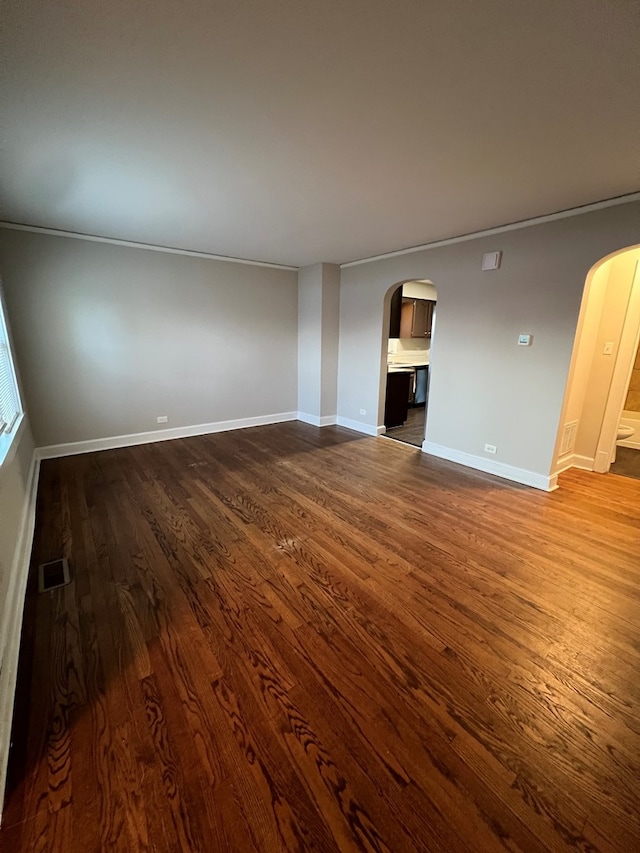 unfurnished living room featuring dark wood-type flooring