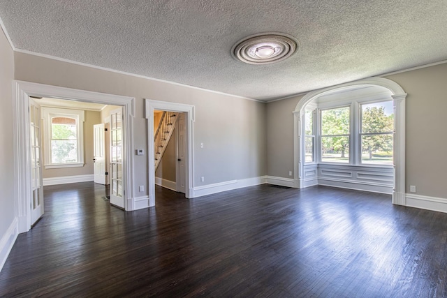 1011 5th St, Mendota, IL 61342 - unfurnished room featuring dark wood-style flooring, a textured ceiling, stairway, ornamental molding, and baseboards
