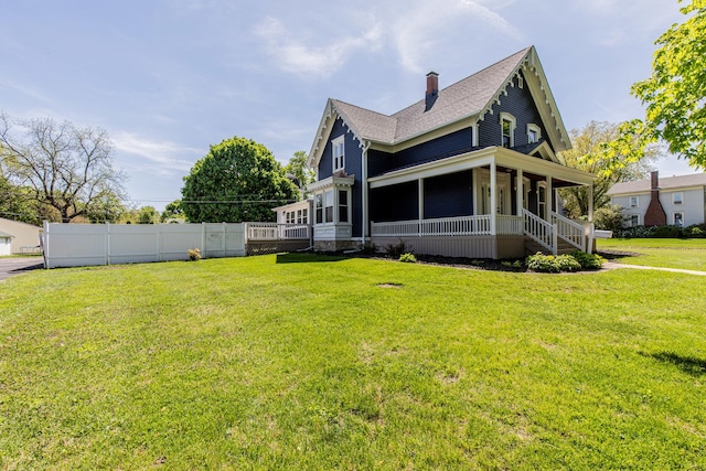 1011 5th St, Mendota, IL 61342 - view of side of property with a chimney, a porch, and a shingled roof