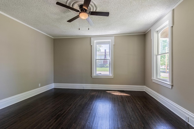 1011 5th St, Mendota, IL 61342 - spare room featuring a textured ceiling, dark wood-type flooring, healthy amount of natural light, baseboards, and ceiling fan