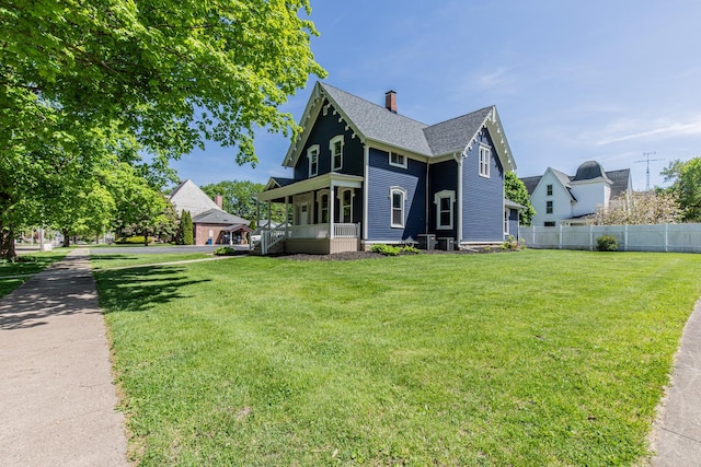 1011 5th St, Mendota, IL 61342 - view of front of home featuring a chimney, roof with shingles, and central air condition unit