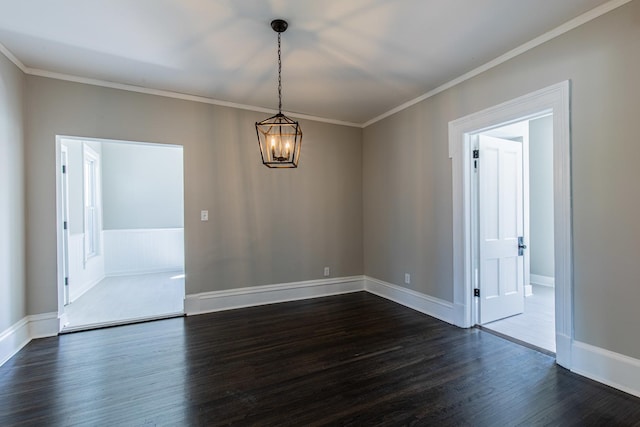 1011 5th St, Mendota, IL 61342 - unfurnished room with dark wood finished floors, a chandelier, ornamental molding, and baseboards