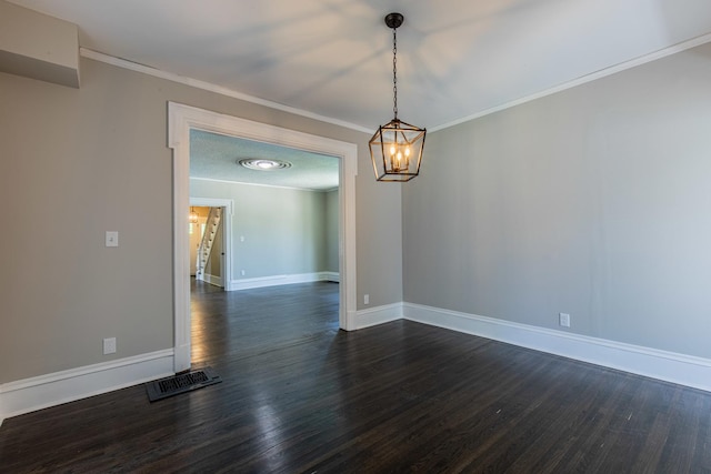 1011 5th St, Mendota, IL 61342 - unfurnished room featuring dark wood finished floors, baseboards, a chandelier, and ornamental molding
